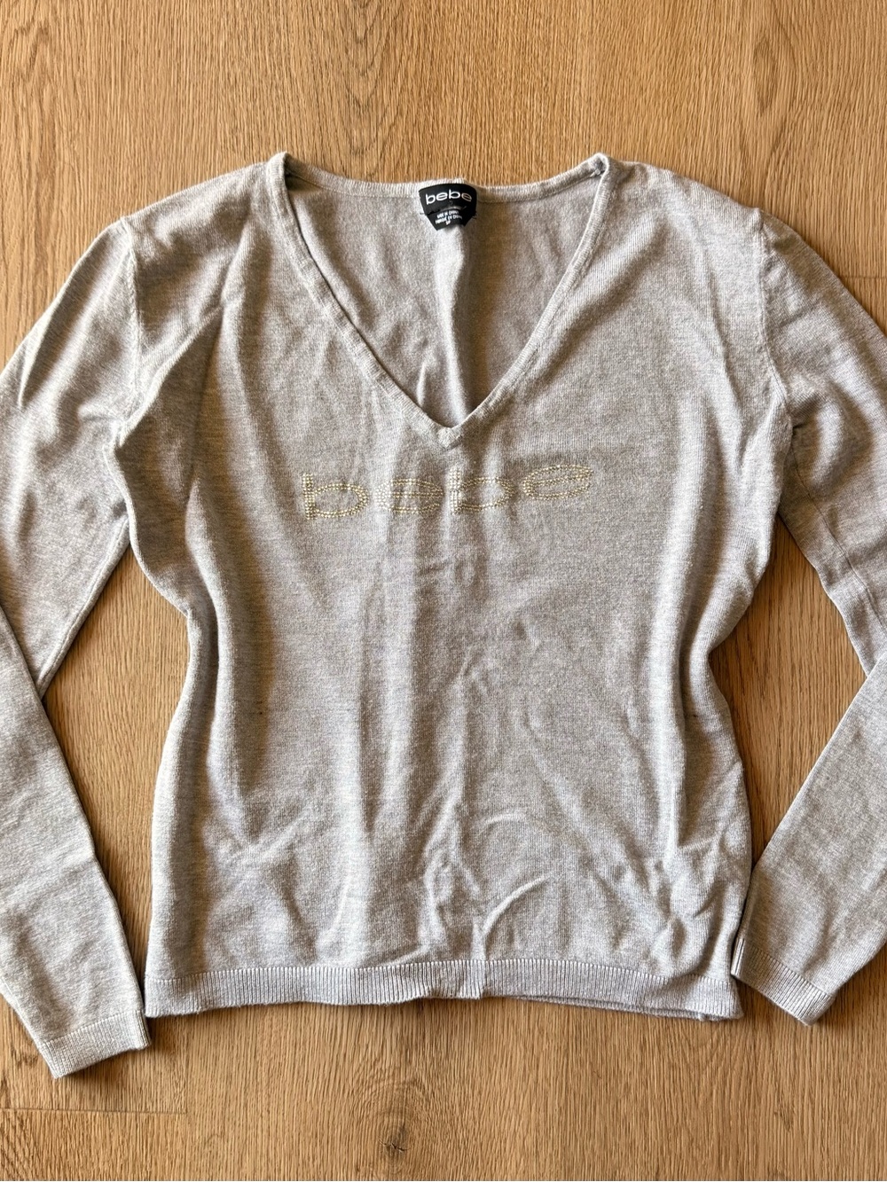 Bebe v-neck long sleeve grey sweater with rhinestone-embellished logo